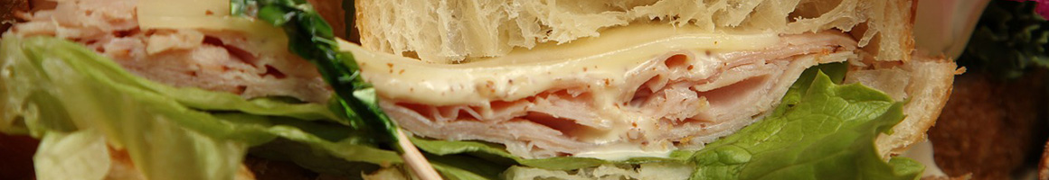 Eating Deli Sandwich at Pile High Deli restaurant in Eureka, CA.
